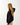 Female wearing oversized black hoodie