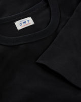 Black t-shirt with a visible brand label on a dark background