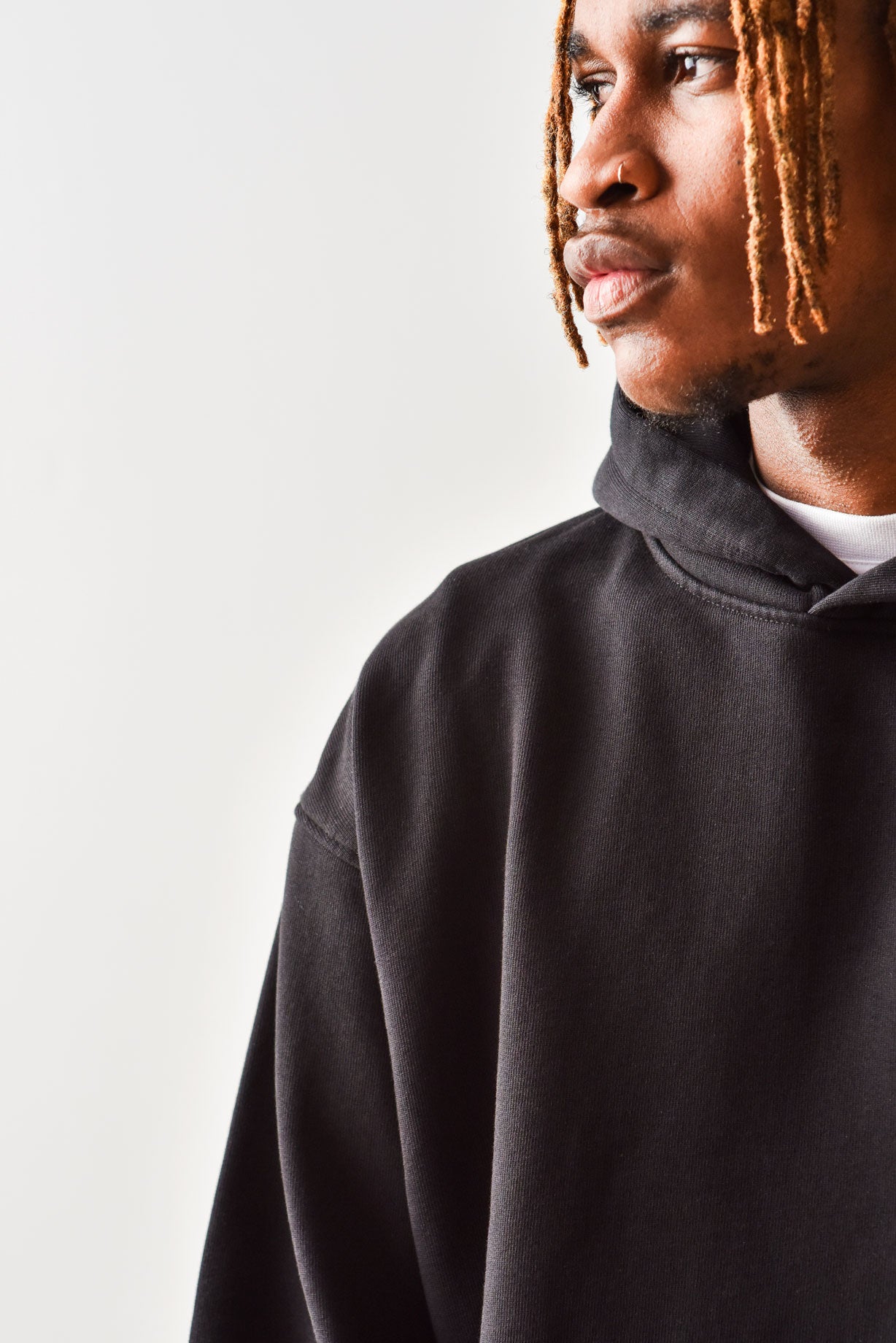 Male in black oversized hoodie