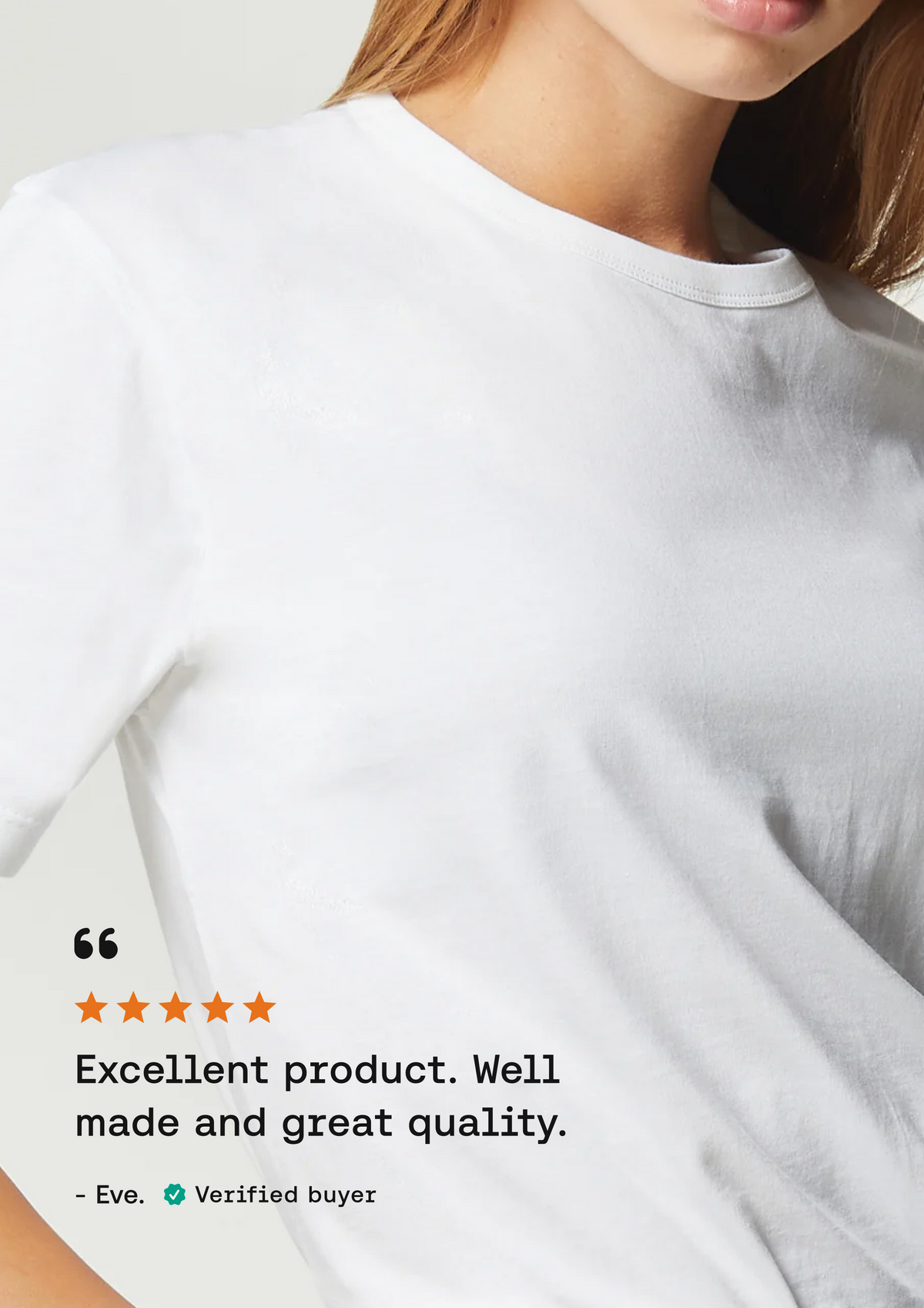 A close-up of a person wearing a plain white crew-neck T-shirt against a light neutral background, with a review overlay on the lower left praising the product.